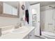 Bright bathroom with a stand alone vanity and full shower at 1845 Kendall St # 325D, Denver, CO 80214