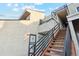 Building entrance with stairs leading to upper units, showcasing accessibility and design at 1845 Kendall St # 325D, Denver, CO 80214