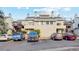 Multi-unit building with ample parking, showcasing an appealing facade for potential residents at 1845 Kendall St # 325D, Denver, CO 80214