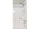 Clean white shower and tub combo featuring updated fixtures at 1845 Kendall St # 325D, Denver, CO 80214