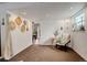 Finished basement area with neutral carpet, natural light, and decor at 12920 W 24Th Pl, Golden, CO 80401