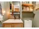 Stylish bathroom featuring updated vanity, toilet, shelves and modern mirror at 12920 W 24Th Pl, Golden, CO 80401