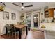 Dining area with wood table, seating, and a view to the backyard at 12920 W 24Th Pl, Golden, CO 80401