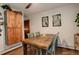 Cozy dining room with a rustic wooden table and seating for four at 12920 W 24Th Pl, Golden, CO 80401