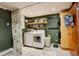 Laundry room with new washer and dryer, cabinets and fern curtain at 12920 W 24Th Pl, Golden, CO 80401