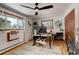 Bright office with hardwood floors, a large window, modern desk, and ceiling fan at 12920 W 24Th Pl, Golden, CO 80401