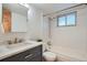 Updated bathroom featuring a marble vanity and shower-tub combination at 155 S Pennsylvania St # 101, Denver, CO 80209