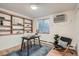 Bright office space with built-in shelving, natural light, and hardwood floors at 155 S Pennsylvania St # 101, Denver, CO 80209