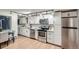 Updated kitchen with white cabinets, stainless steel appliances, and quartz countertops at 155 S Pennsylvania St # 101, Denver, CO 80209