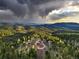 Stunning home with mountain views and a large circular driveway at 26271 Richmond Hill Rd, Conifer, CO 80433