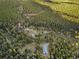 Aerial view of property showing a large shop and access road at 26271 Richmond Hill Rd, Conifer, CO 80433