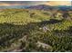 Secluded mountain home with a long driveway and beautiful scenery at 26271 Richmond Hill Rd, Conifer, CO 80433