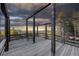 Rustic deck with mountain views and bench at 26271 Richmond Hill Rd, Conifer, CO 80433