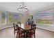 Elegant dining room with hardwood floors and stunning mountain views at 26271 Richmond Hill Rd, Conifer, CO 80433