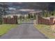 Gated entry with brick pillars and private drive at 26271 Richmond Hill Rd, Conifer, CO 80433