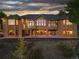 Brick home with a large deck and stunning sunset views at 26271 Richmond Hill Rd, Conifer, CO 80433