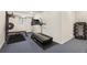 Basement home gym, featuring a treadmill and weight equipment at 26271 Richmond Hill Rd, Conifer, CO 80433