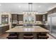 Gourmet kitchen with large island, stainless steel appliances, and granite countertops at 26271 Richmond Hill Rd, Conifer, CO 80433