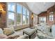 Relaxing sunroom with ample natural light and comfortable seating at 26271 Richmond Hill Rd, Conifer, CO 80433