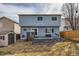 Home's back exterior featuring wood siding, a deck, and fenced backyard with a storage shed at 3532 Morning Glory Dr, Castle Rock, CO 80109