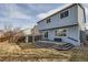 View of the home's back exterior showing a deck, siding and fenced yard with shed at 3532 Morning Glory Dr, Castle Rock, CO 80109