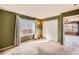 This green bedroom offers a large window and double closet at 3532 Morning Glory Dr, Castle Rock, CO 80109