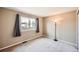 Bedroom features neutral carpet and walls, with a window providing natural light and views at 3532 Morning Glory Dr, Castle Rock, CO 80109