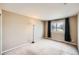 Neutral bedroom featuring carpet, and a window dressed with black curtains at 3532 Morning Glory Dr, Castle Rock, CO 80109