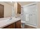 Bathroom with shower, wood cabinet and sink at 272 S 22Nd Ave, Brighton, CO 80601