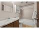 This bathroom features neutral tile, a shower and tub, along with classic cabinets at 272 S 22Nd Ave, Brighton, CO 80601
