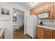 Kitchen area with white appliances and a view to the dining area at 272 S 22Nd Ave, Brighton, CO 80601