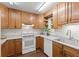 Efficient kitchen featuring wood cabinets, white countertops, and modern appliances at 272 S 22Nd Ave, Brighton, CO 80601