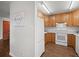 A well-lit kitchen with white appliances and laminate flooring at 272 S 22Nd Ave, Brighton, CO 80601
