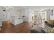 Comfortable living room with hardwood floors, gray sofa, and view of the dining area at 272 S 22Nd Ave, Brighton, CO 80601