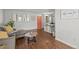 A relaxing living room featuring hardwood floors, a comfortable gray sofa and an orange door at 272 S 22Nd Ave, Brighton, CO 80601