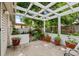 Charming patio with pergola, colorful flowers, and a serene outdoor ambiance at 272 S 22Nd Ave, Brighton, CO 80601