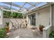 Relaxing patio with overhead shade trellis, lush plants, and comfortable outdoor seating at 272 S 22Nd Ave, Brighton, CO 80601
