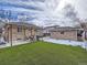 Large backyard with artificial turf and shed at 1333 Hanover St, Aurora, CO 80010