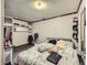 Basement bedroom with gray carpet and shelving at 1333 Hanover St, Aurora, CO 80010