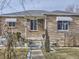 Brick Ranch home with mature trees and walkway at 1333 Hanover St, Aurora, CO 80010