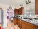 Galley kitchen with wood cabinets and appliances at 1333 Hanover St, Aurora, CO 80010