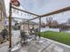 Patio area with pergola, lights, and seating at 1333 Hanover St, Aurora, CO 80010