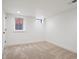 Unfurnished basement bedroom with neutral carpet and windows at 4710 W 32Nd Ave, Denver, CO 80212