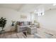 Finished basement with a gray sofa, an ottoman, and stylish decor at 4710 W 32Nd Ave, Denver, CO 80212