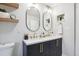 Bathroom boasting a double vanity with marble countertop and modern finishes at 4710 W 32Nd Ave, Denver, CO 80212