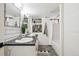Contemporary bathroom featuring double sinks, subway tiles, and modern fixtures at 4710 W 32Nd Ave, Denver, CO 80212