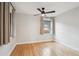 Bright bedroom with hardwood floors, a ceiling fan, and a large window at 4710 W 32Nd Ave, Denver, CO 80212