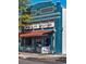 Charming Mead St. Station building with blue brick facade and inviting outdoor seating area at 4710 W 32Nd Ave, Denver, CO 80212