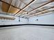 Spacious garage featuring epoxy flooring, ample lighting, and storage space for vehicles and projects at 4710 W 32Nd Ave, Denver, CO 80212