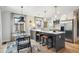 Bright, updated kitchen featuring a large island, stainless steel appliances, and modern lighting at 4710 W 32Nd Ave, Denver, CO 80212
